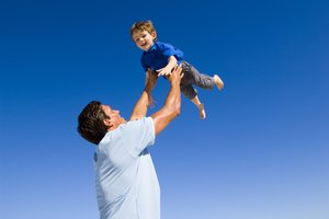 Father and son playing on beach
