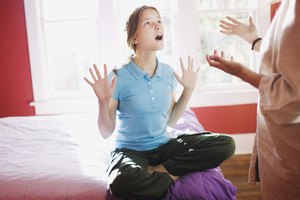 Preteen girl arguing with mother in bedroom