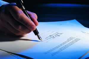 Businessman, hand holding pen, signing contract,