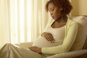 Pensive pregnant woman
