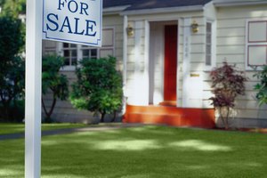 For Sale Sign in Front of a House