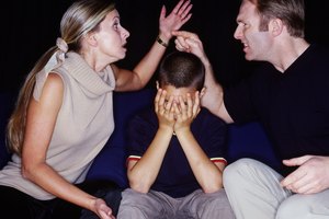 husband and wife fighting with a child sitting between them