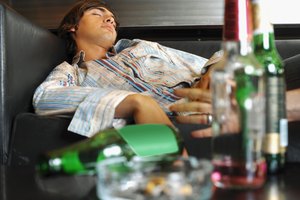 Young man sleeping in a bar