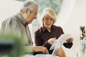 Mature Couple Working at Home