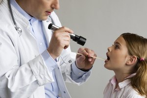 Doctor examining girl
