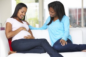 Woman Visiting Pregnant Friend At Home